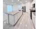 Spacious kitchen featuring granite countertops, stainless steel appliances, and a large kitchen island at 7708 Mojave Wind Ave, Las Vegas, NV 89113
