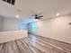 Cozy upstairs loft area with wood-look flooring and abundant natural light at 7708 Mojave Wind Ave, Las Vegas, NV 89113