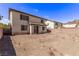 Exterior view of a home with a patio and large yard at 774 Wigan Pier Dr, Henderson, NV 89002