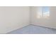 Carpeted bedroom with window and neutral walls at 774 Wigan Pier Dr, Henderson, NV 89002