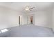 Spacious bedroom with neutral walls, ceiling fan, and two entryways at 774 Wigan Pier Dr, Henderson, NV 89002