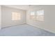 Bedroom featuring blue carpet and natural light from multiple windows at 774 Wigan Pier Dr, Henderson, NV 89002