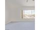Bedroom featuring blue carpet, natural light, and views from a large window at 774 Wigan Pier Dr, Henderson, NV 89002