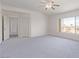 Bright bedroom with a window view, ceiling fan, and closet at 774 Wigan Pier Dr, Henderson, NV 89002