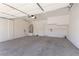 Garage with water heater, storage racks, and ample space for vehicles and equipment at 774 Wigan Pier Dr, Henderson, NV 89002