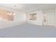 Carpeted living room area with natural lighting and neutral walls at 774 Wigan Pier Dr, Henderson, NV 89002