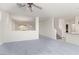 Large living room that connects to dining area and kitchen, with stairway in view at 774 Wigan Pier Dr, Henderson, NV 89002