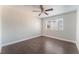 A cozy bedroom featuring wood flooring and a bright, sunlit window at 8600 W Charleston Blvd # 2108, Las Vegas, NV 89117