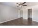 An empty bedroom with hardwood floors, a ceiling fan and a walk-in closet at 8600 W Charleston Blvd # 2108, Las Vegas, NV 89117