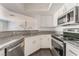 Well-lit kitchen with stainless steel appliances, granite countertops, and white cabinetry at 8600 W Charleston Blvd # 2108, Las Vegas, NV 89117
