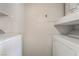 A laundry room with a washer and dryer and some shelving at 8600 W Charleston Blvd # 2108, Las Vegas, NV 89117