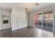 Large living room with ceiling fan, sliding glass doors to the balcony, and wood-look floors at 8600 W Charleston Blvd # 2108, Las Vegas, NV 89117