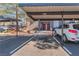 Assigned and covered parking spots with the apartment building in the background at 8600 W Charleston Blvd # 2108, Las Vegas, NV 89117