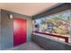 A patio with a red door that overlooks the courtyard at 8600 W Charleston Blvd # 2108, Las Vegas, NV 89117