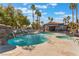 Beautiful community pool with a rock waterfall feature and comfortable lounge chairs at 8600 W Charleston Blvd # 2108, Las Vegas, NV 89117