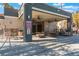 Inviting poolside seating area with tables, chairs, and ceiling fans for relaxation at 8600 W Charleston Blvd # 2108, Las Vegas, NV 89117