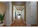 Inviting hallway with hardwood floors leads to a living room, creating a seamless flow throughout the home at 8604 Amber Autumn St, Las Vegas, NV 89131