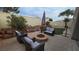 Backyard oasis featuring a fire pit, desert landscaping, and outdoor seating at 8824 Martin Downs Pl, Las Vegas, NV 89131