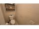Compact powder room with a toilet and wall decorations at 8824 Martin Downs Pl, Las Vegas, NV 89131