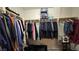 Spacious walk-in closet with organized clothing racks and shelves, providing ample storage space and organization at 8824 Martin Downs Pl, Las Vegas, NV 89131