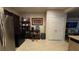 Additional kitchen space with stainless steel refrigerator and shelving at 8824 Martin Downs Pl, Las Vegas, NV 89131