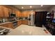 Bright kitchen with stainless steel appliances, wood cabinets, and gas range at 8824 Martin Downs Pl, Las Vegas, NV 89131