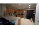 Functional kitchen featuring ample wood cabinetry, stainless steel appliances, and a breakfast bar at 8824 Martin Downs Pl, Las Vegas, NV 89131