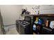 Well-organized laundry room with modern washer and dryer, storage shelves and extra supplies at 8824 Martin Downs Pl, Las Vegas, NV 89131