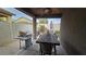 Covered patio with grill and outdoor dining area, perfect for entertaining at 8824 Martin Downs Pl, Las Vegas, NV 89131