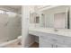 Bathroom features a vanity with storage, and a glass enclosed shower at 8920 Litchfield Ave, Las Vegas, NV 89134