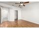 Spacious bedroom with laminate floors, ceiling fan, and closet space at 8920 Litchfield Ave, Las Vegas, NV 89134