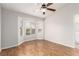 Bedroom with laminate floors, ceiling fan, and large windows at 8920 Litchfield Ave, Las Vegas, NV 89134