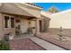 Charming courtyard featuring desert landscaping, a decorative fountain, seating, and well-maintained exteriors at 8920 Litchfield Ave, Las Vegas, NV 89134