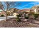 Attractive home with a two-car garage, gated courtyard entrance, mature trees, and xeriscaping for easy maintenance at 8920 Litchfield Ave, Las Vegas, NV 89134