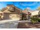 Charming single-story home featuring a two-car garage, well-maintained landscaping, and a walkway leading to the entrance at 8920 Litchfield Ave, Las Vegas, NV 89134