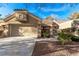 Charming single-story home featuring a two-car garage, well-maintained landscaping, and a walkway leading to the entrance at 8920 Litchfield Ave, Las Vegas, NV 89134