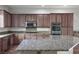Spacious kitchen with granite countertops, stainless steel appliances, and custom wood cabinets at , Las Vegas, NV 89131