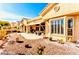 Backyard with desert landscape featuring a tiled roof, and stone details at 10709 Brinkwood Ave, Las Vegas, NV 89134