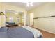 Bright bedroom with closet mirrors reflecting the features of the bedroom at 10709 Brinkwood Ave, Las Vegas, NV 89134