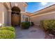 Elegant double front doors with a covered porch and landscaped entrance at 10709 Brinkwood Ave, Las Vegas, NV 89134