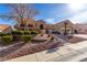 Beautiful single-story home with a well-maintained front yard and neutral color scheme at 10709 Brinkwood Ave, Las Vegas, NV 89134