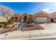 Charming single-story home featuring a manicured front yard and attached garage at 10709 Brinkwood Ave, Las Vegas, NV 89134