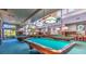 Game room featuring multiple pool tables, overhead lighting, and ample seating at 10709 Brinkwood Ave, Las Vegas, NV 89134