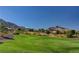 Scenic golf course view with mountains in the background and clear blue sky at 10709 Brinkwood Ave, Las Vegas, NV 89134