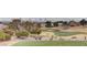 Scenic golf course view with lush greens, sand traps, and mature trees with a city view in the background at 10709 Brinkwood Ave, Las Vegas, NV 89134