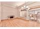 Bright living room with hardwood flooring, modern lighting, and a sliding glass door at 10709 Brinkwood Ave, Las Vegas, NV 89134