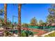 Well-maintained outdoor tennis courts surrounded by lush greenery, promoting an active lifestyle within the community at 10709 Brinkwood Ave, Las Vegas, NV 89134