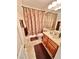 This bathroom includes a single vanity and a shower with decorative brown curtain at 11027 Dornoch Castle St, Las Vegas, NV 89141