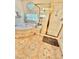 Bathroom featuring a shower with gold trim and tiled flooring at 11027 Dornoch Castle St, Las Vegas, NV 89141