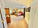 Spacious bedroom featuring a ceiling fan, carpet flooring, and a large window for natural light at 11027 Dornoch Castle St, Las Vegas, NV 89141